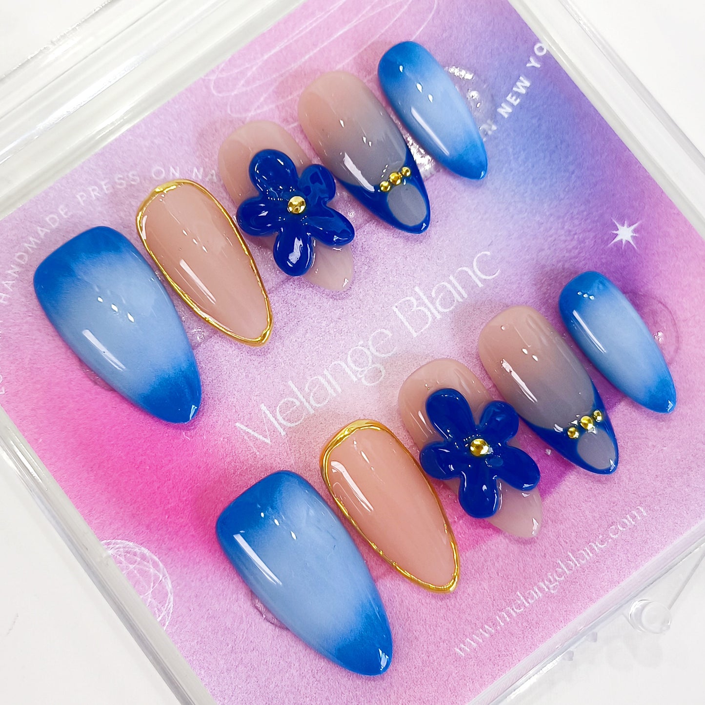 Blue aurora ombre with gold chrome flower almond press on nails