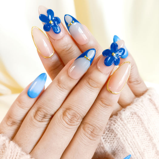 Blue aurora ombre with gold chrome flower almond press on nails