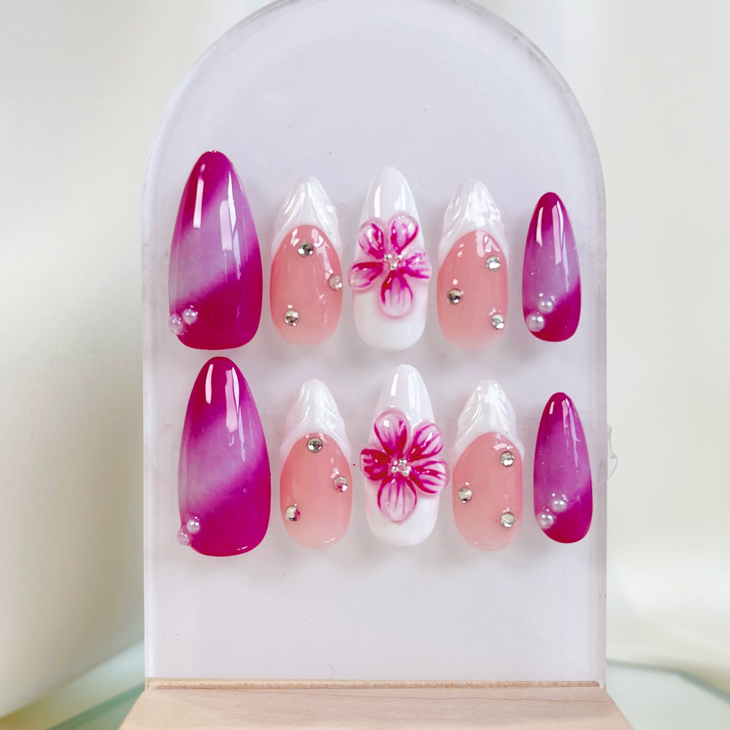 Fuchsia pink flower & french tip aurora almond press on nails