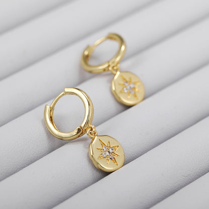 E056 gold starburst dangle earrings