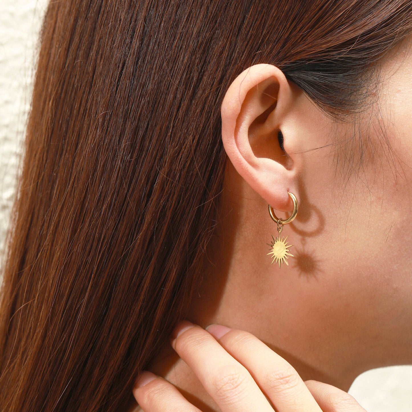 Reagan starburst dangle huggie earrings