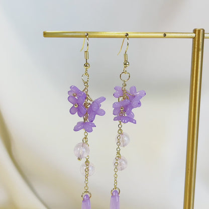 E195 purple lily flower long dangle earrings